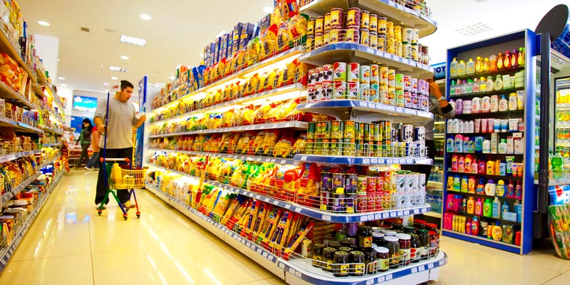 Aisles in a supermarket with food on the shelves