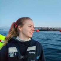Heidi Vesterinen smiling on a salmon boat