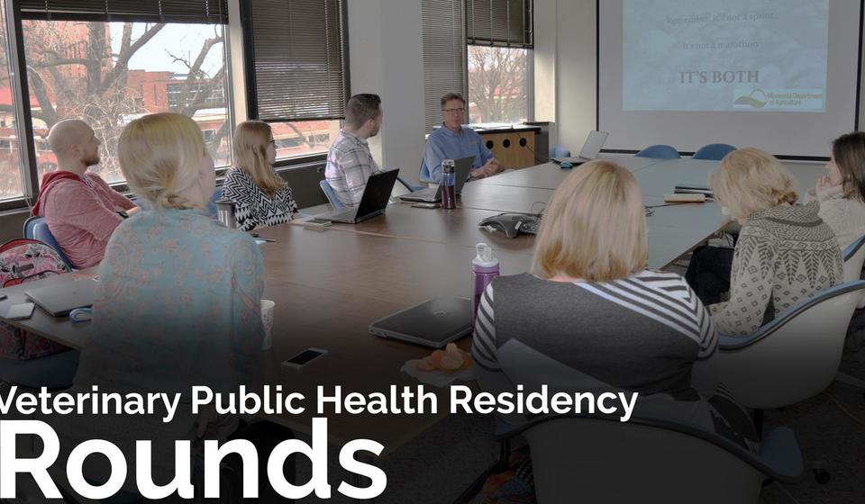 residents listening to a rounds presentation; text on image says "Veterinary Public Health Residency Rounds"