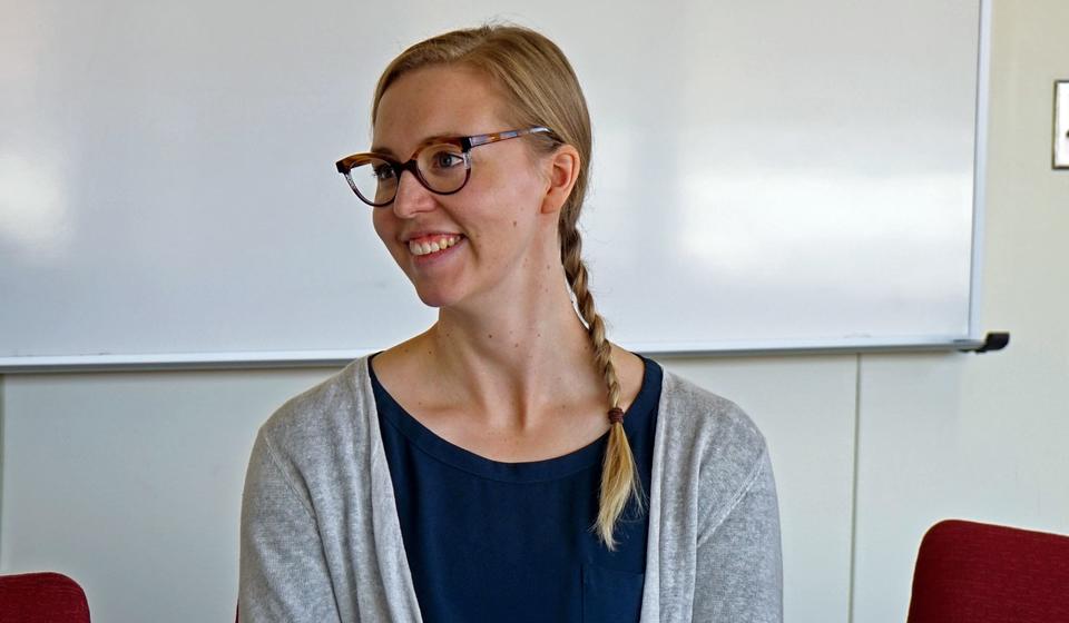 Heidi Vesterinen smiling during a seminar